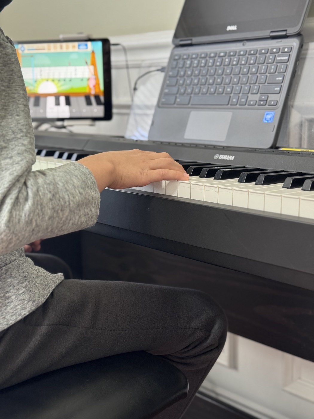 Student with Piano Express app at piano
