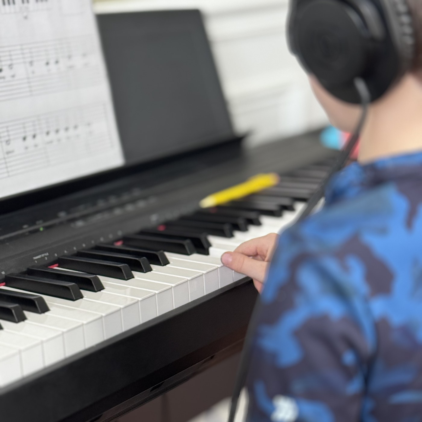 Student focused at piano